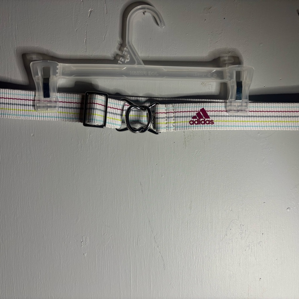 Adidas woman’s  M/L adjustable' Multicolor Belt with front metal clasp.